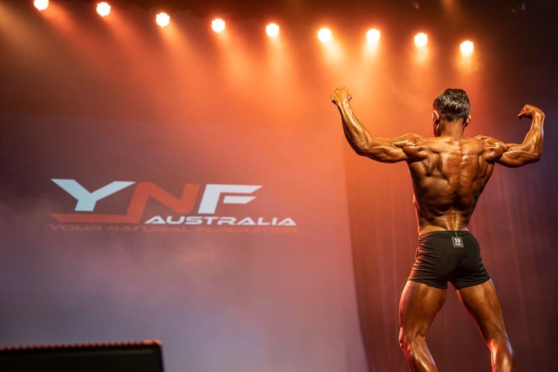 Male bodybuilder on stage at a YNF show